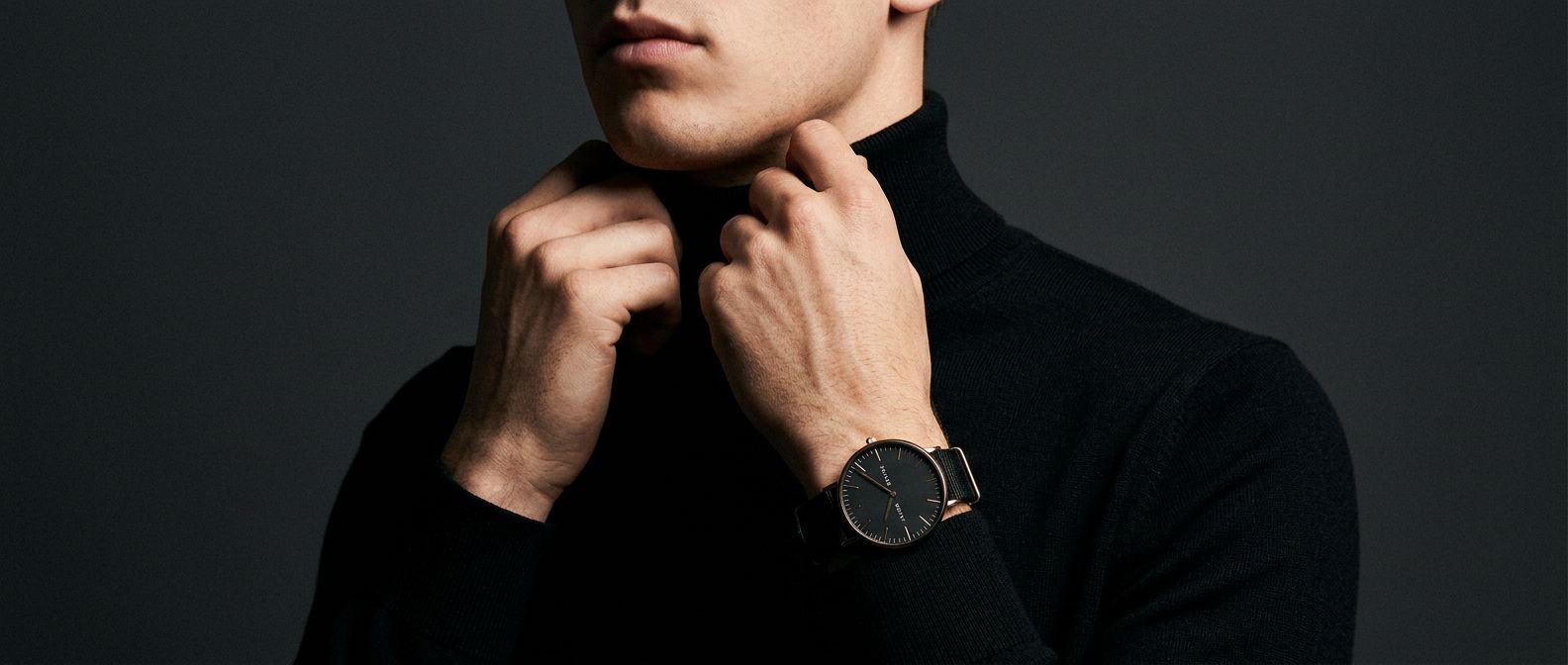 Man in a black turtleneck wearing the black watch